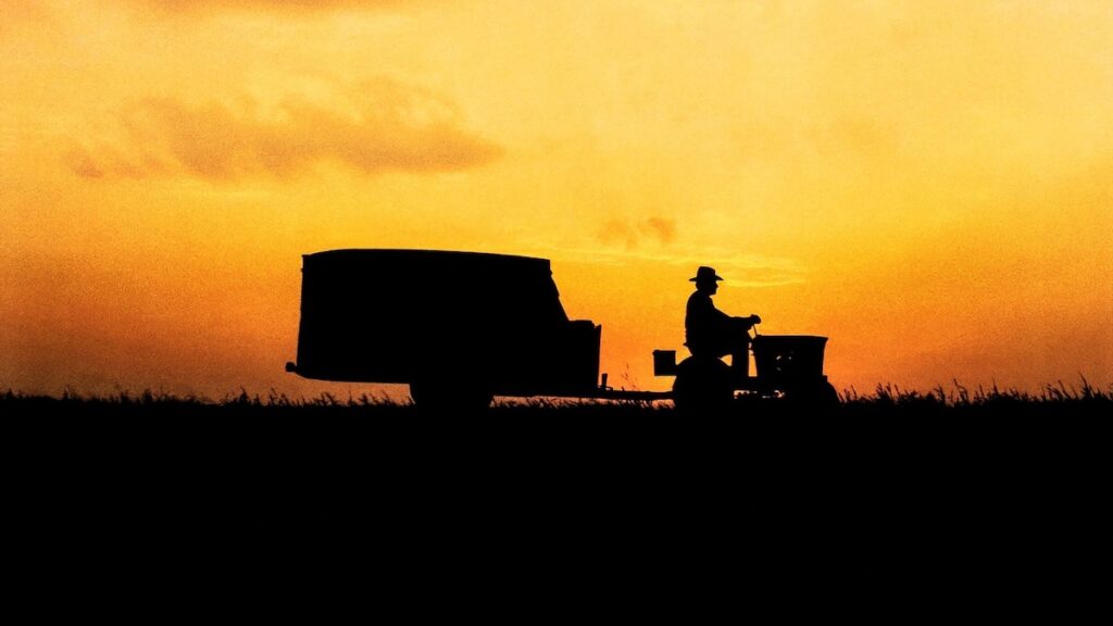 Une Histoire vraie Lynch coucher de soleil tracteur cowboy remorque.